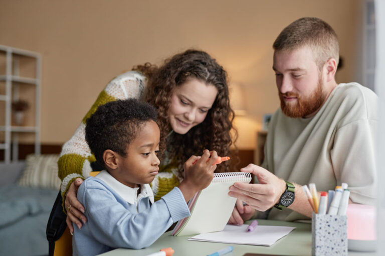 smiling-young-mom-and-dad-drawing-with-adopted-chi-2024-11-15-17-47-15-utc